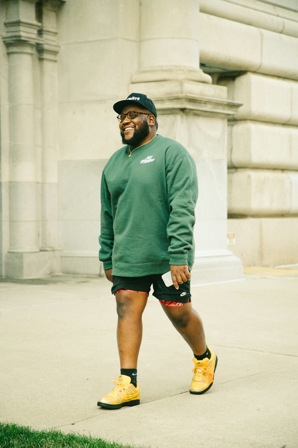 Man in green sweater and black shorts running on road during daytime photo  – Free Mi Image on Unsplash