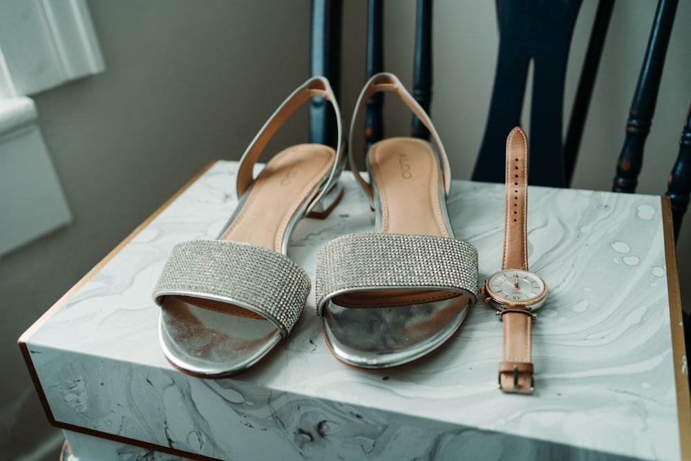 white and brown leather sandals