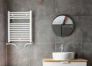 white ceramic bathtub beside white ceramic bathtub