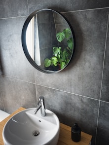 white ceramic sink with stainless steel faucet