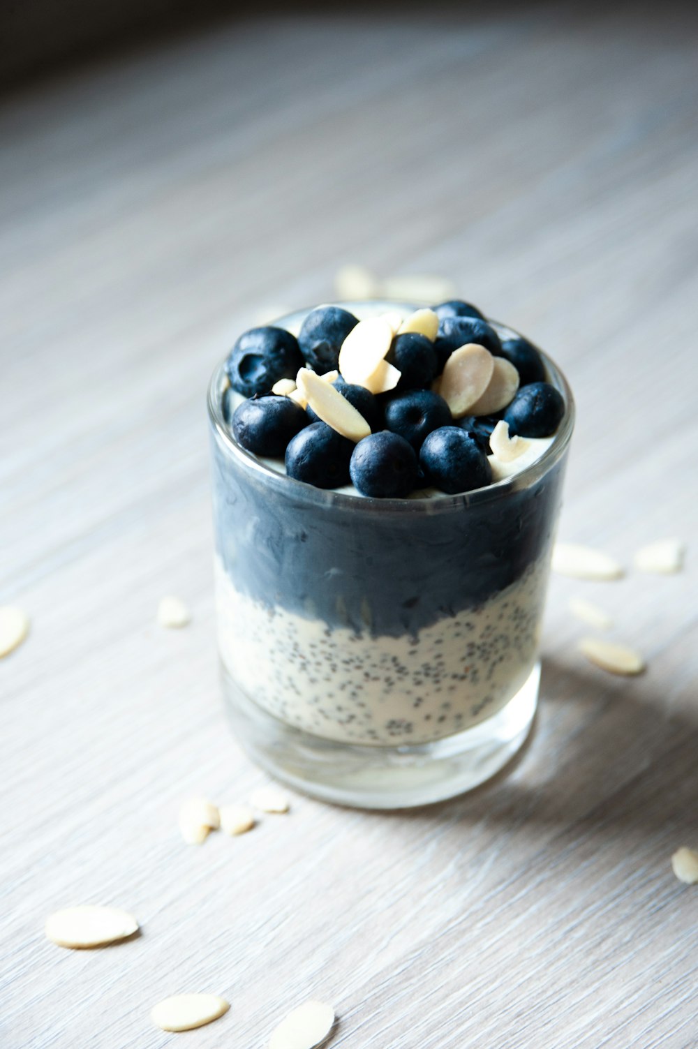 blue berries in clear glass cup