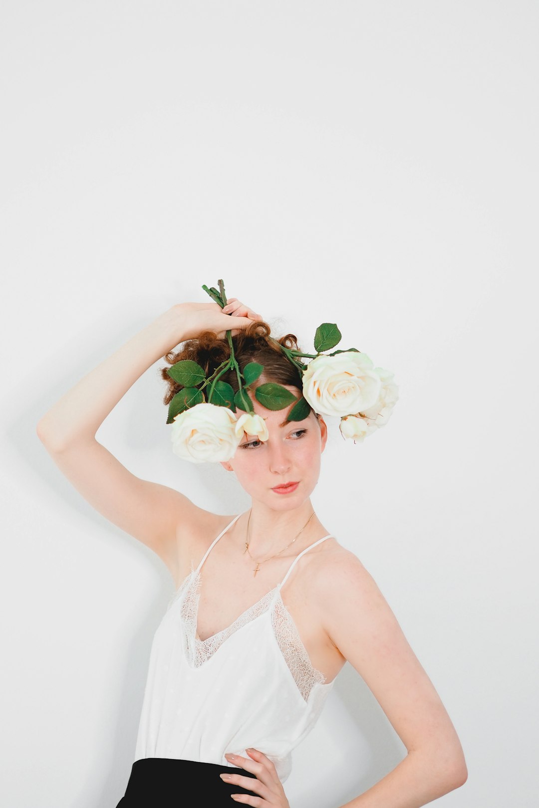 woman in white floral brassiere with white rose on head