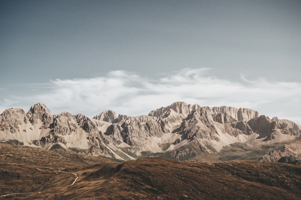 brown and white mountains under blue sky during daytime