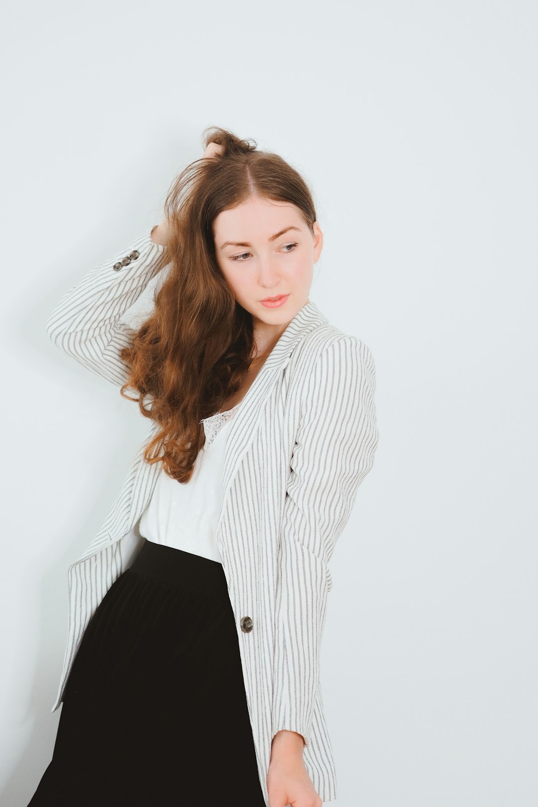 woman in white and black pinstripe dress shirt