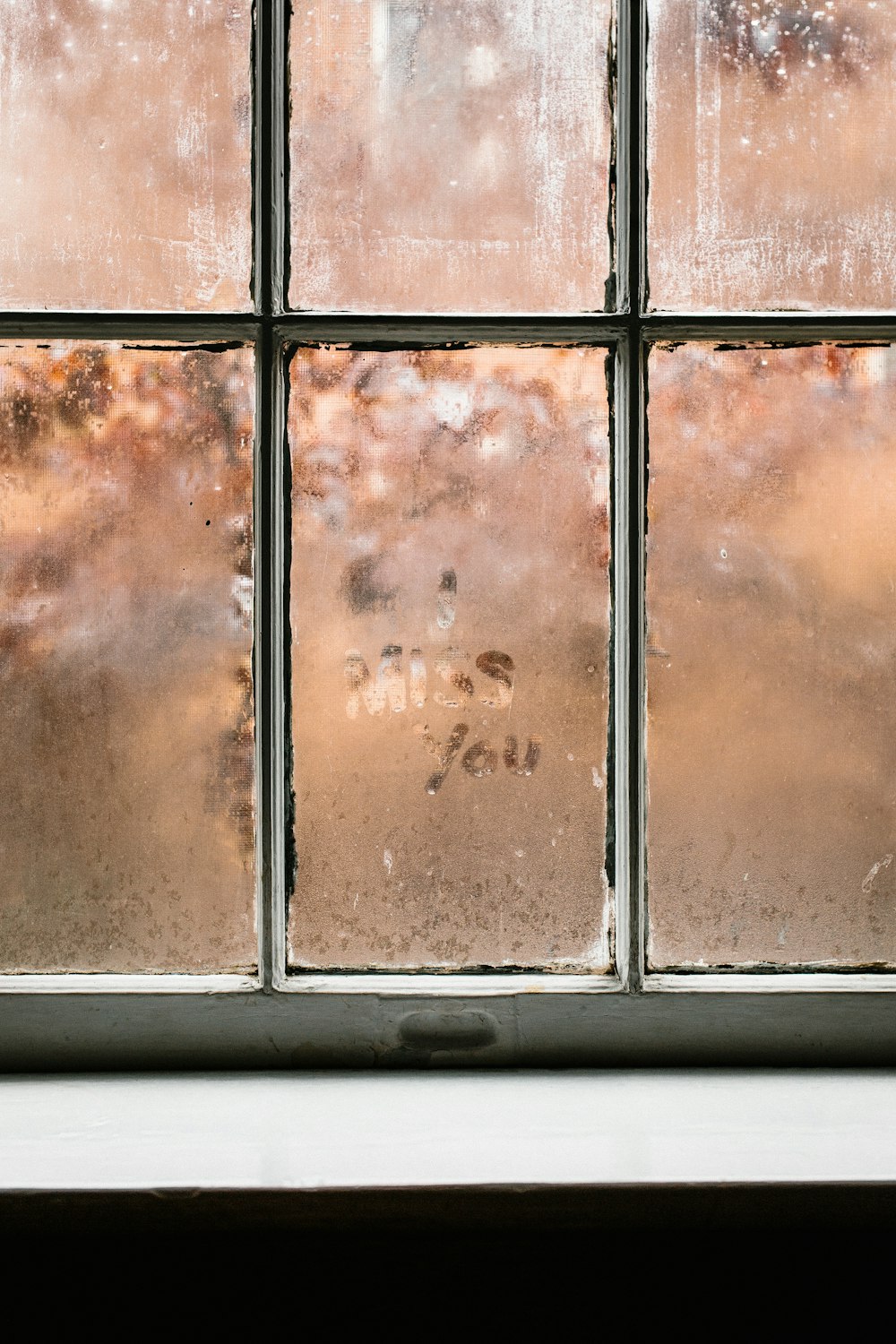 black metal framed glass window