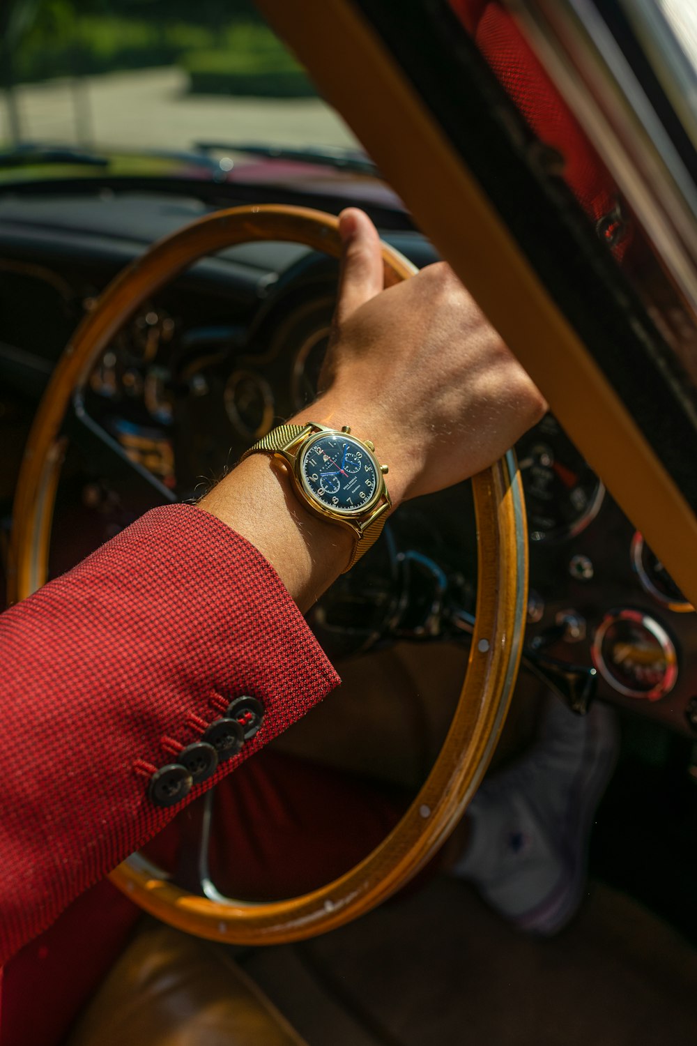 person wearing gold and silver round analog watch