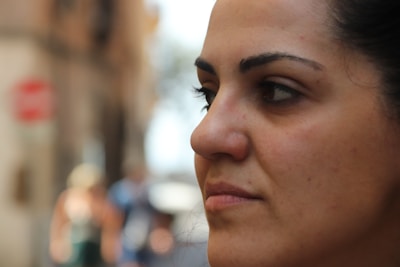 Blurred faces of women and young people engaged in document delivery and reception tasks.