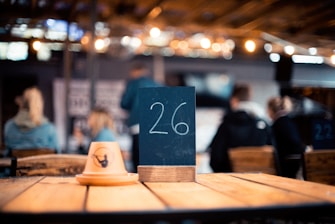 Close-up of a sleek, modern table call button integrated into a stylish restaurant table.