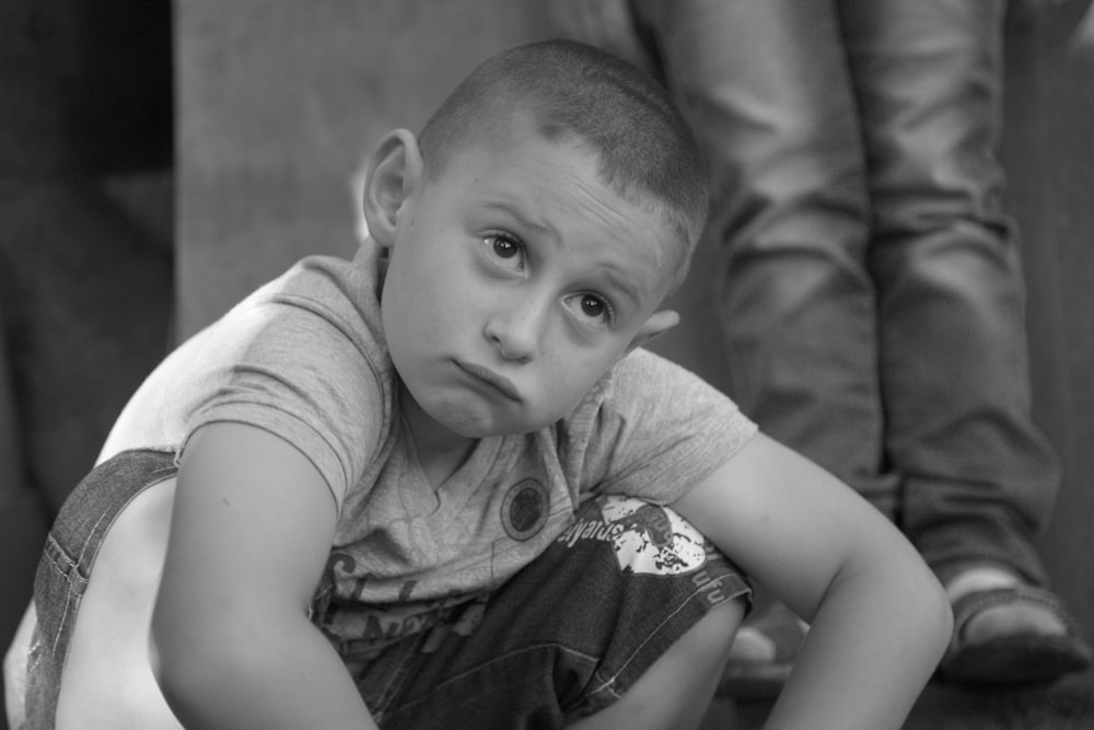 grayscale photo of boy in polo shirt