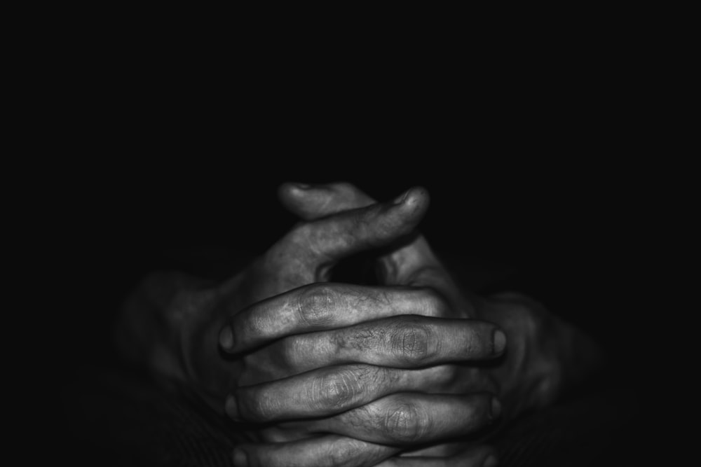 grayscale photo of persons hand