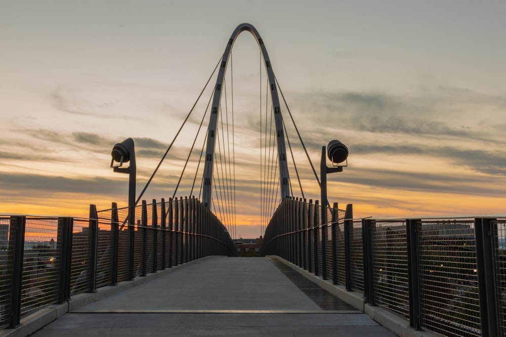 brown wooden bridge under white sky during daytime