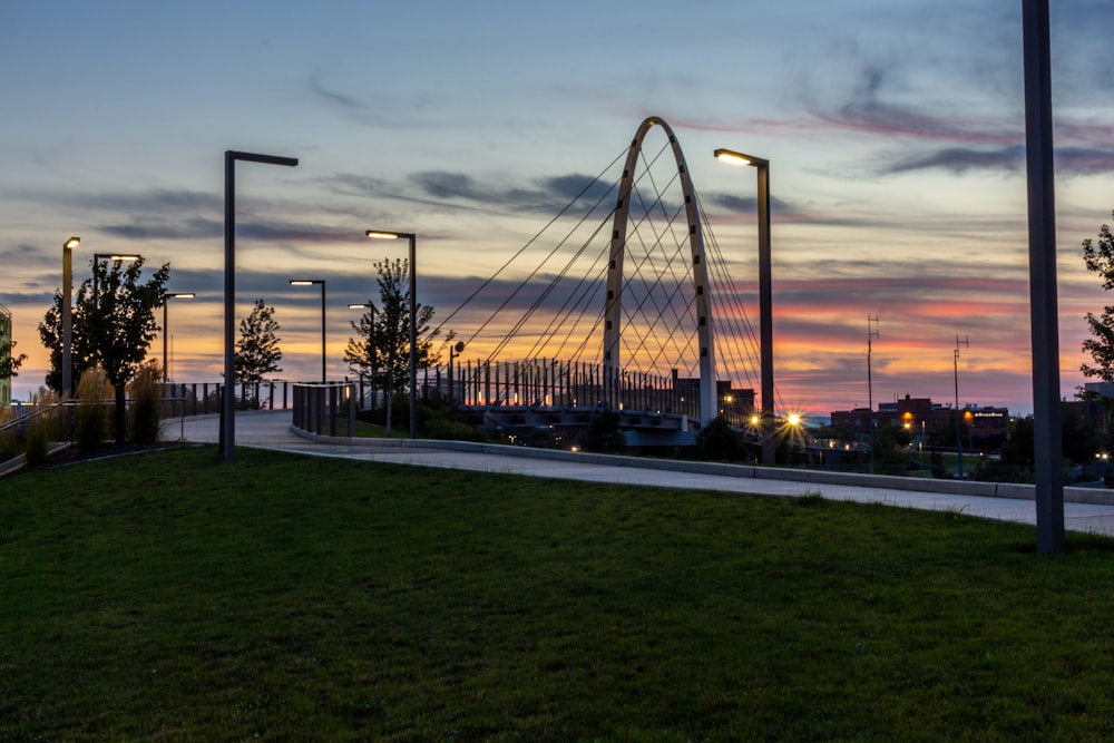 bridge over body of water during sunset