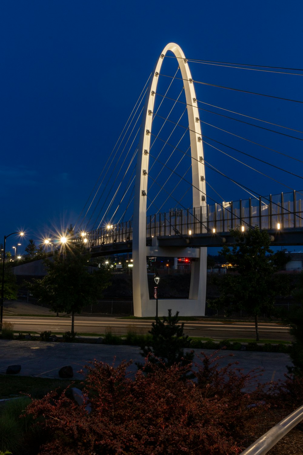 white and gray bridge under blue sky during night time