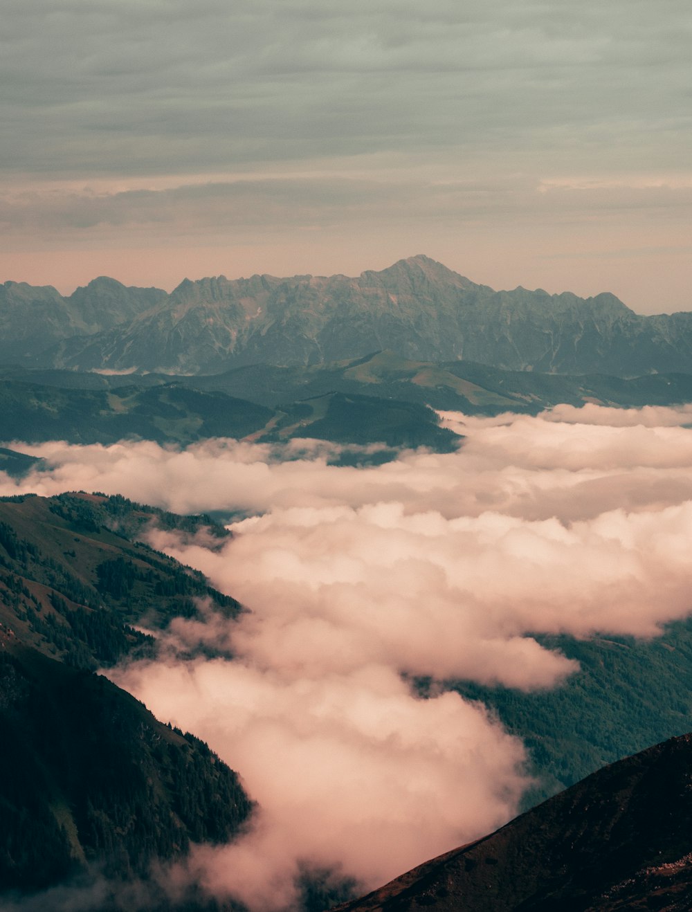 aerial view of mountains covered with clouds