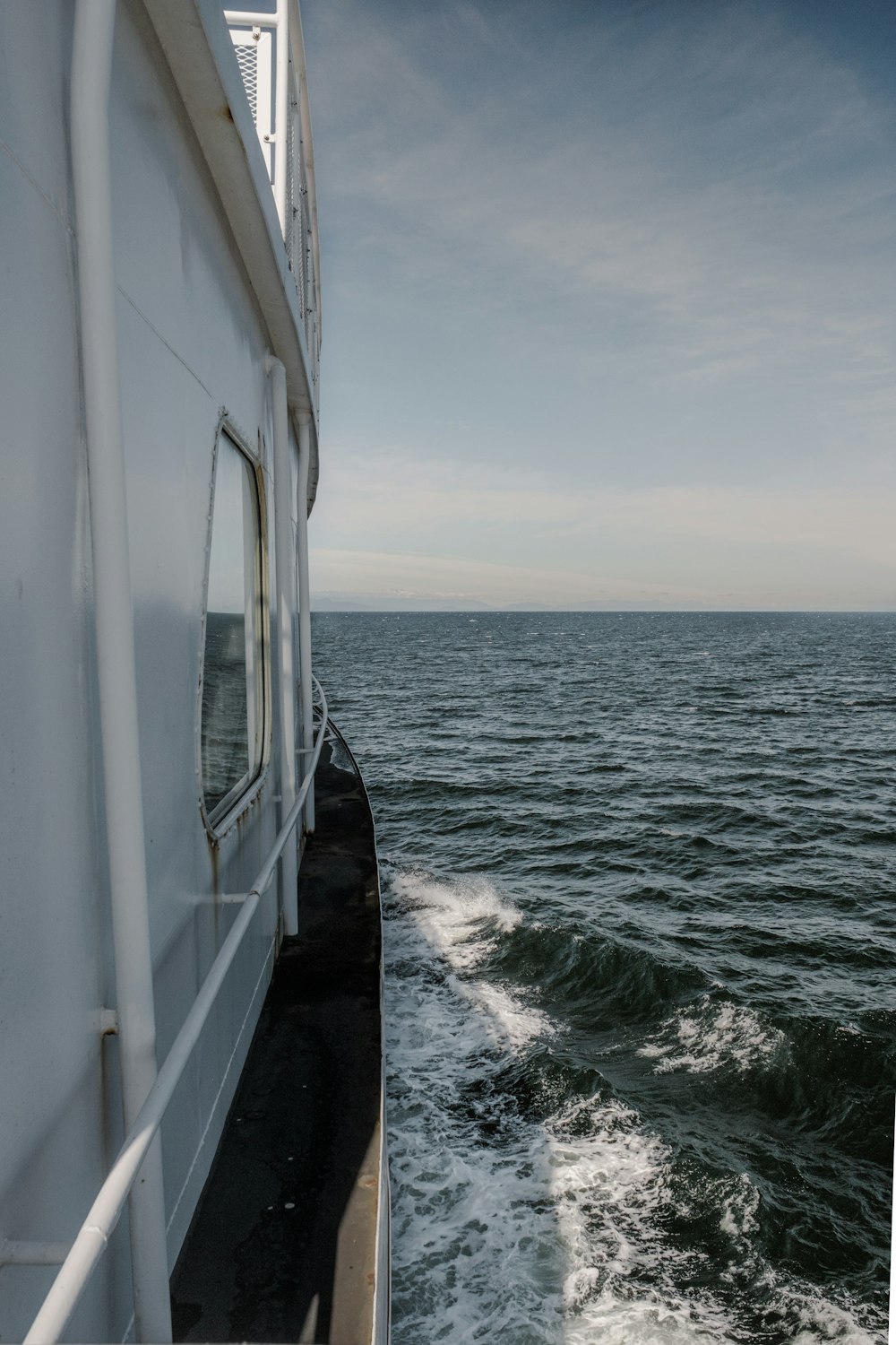 white boat on sea during daytime