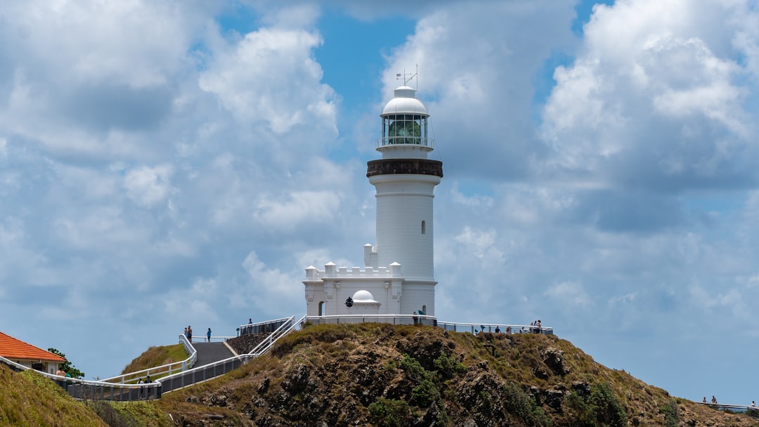 white lighthouse under blue sky during daytime