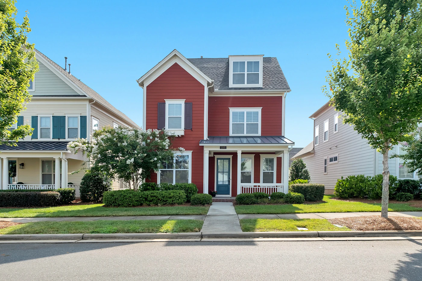A family home with a bright exterior and mature landscaping