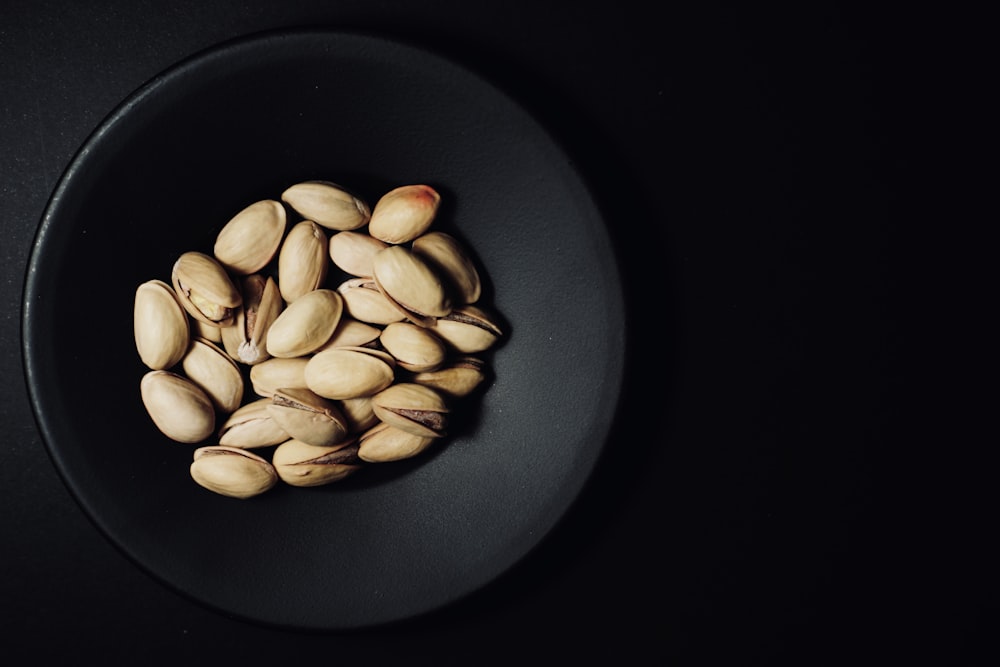 white round beans on black round plate