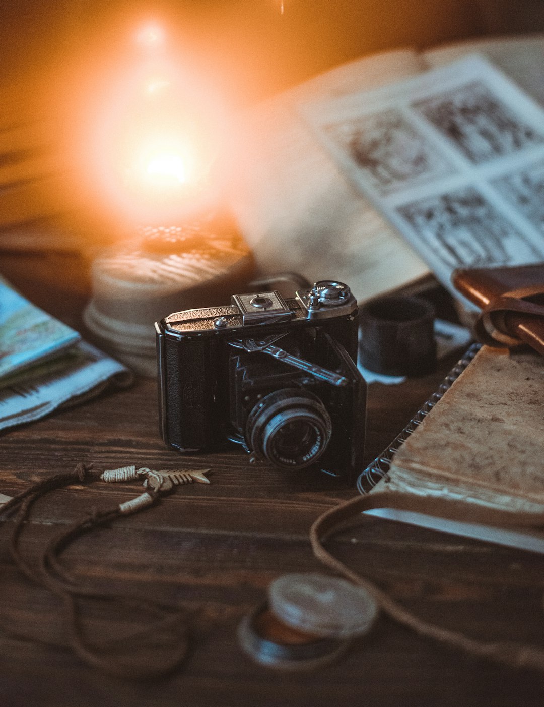 black and silver camera on brown wooden table