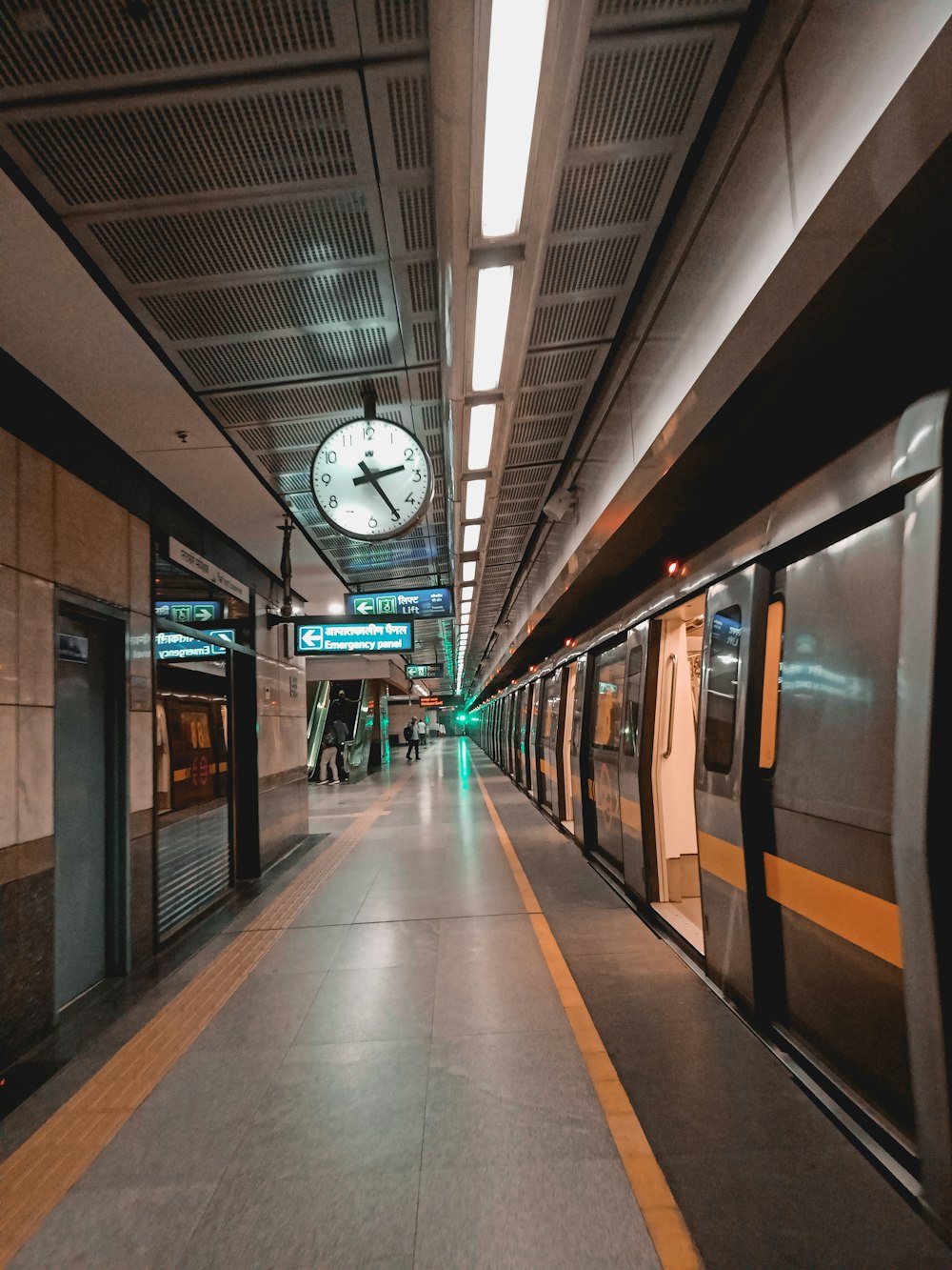 white and black train in train station