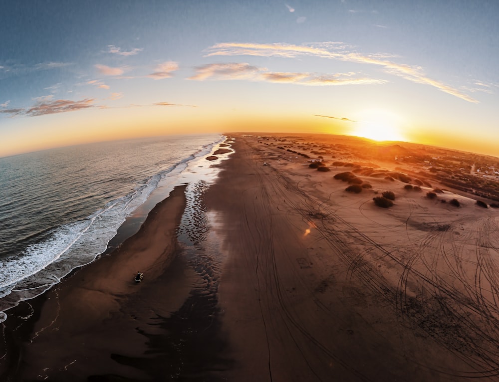 body of water during sunset