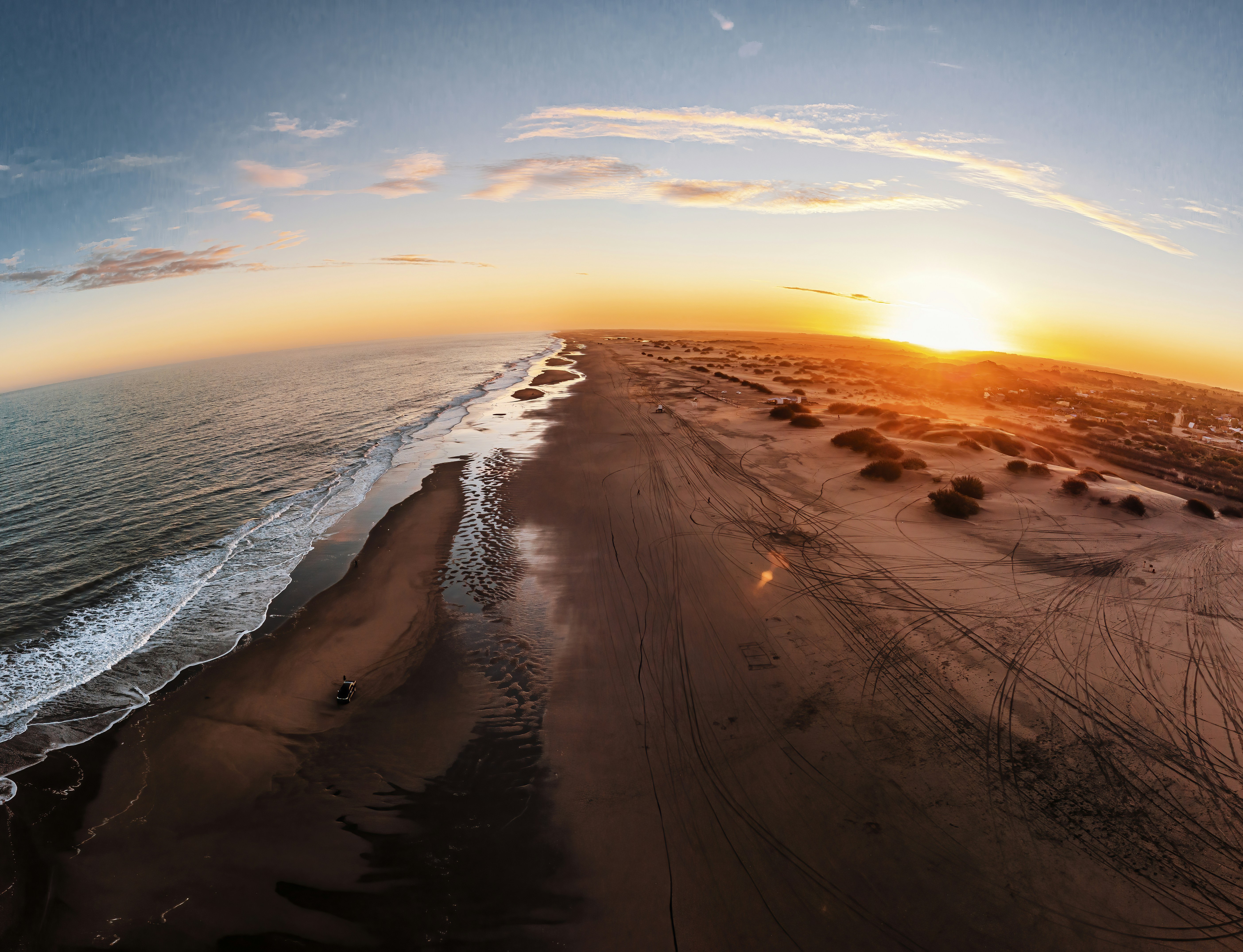 body of water during sunset