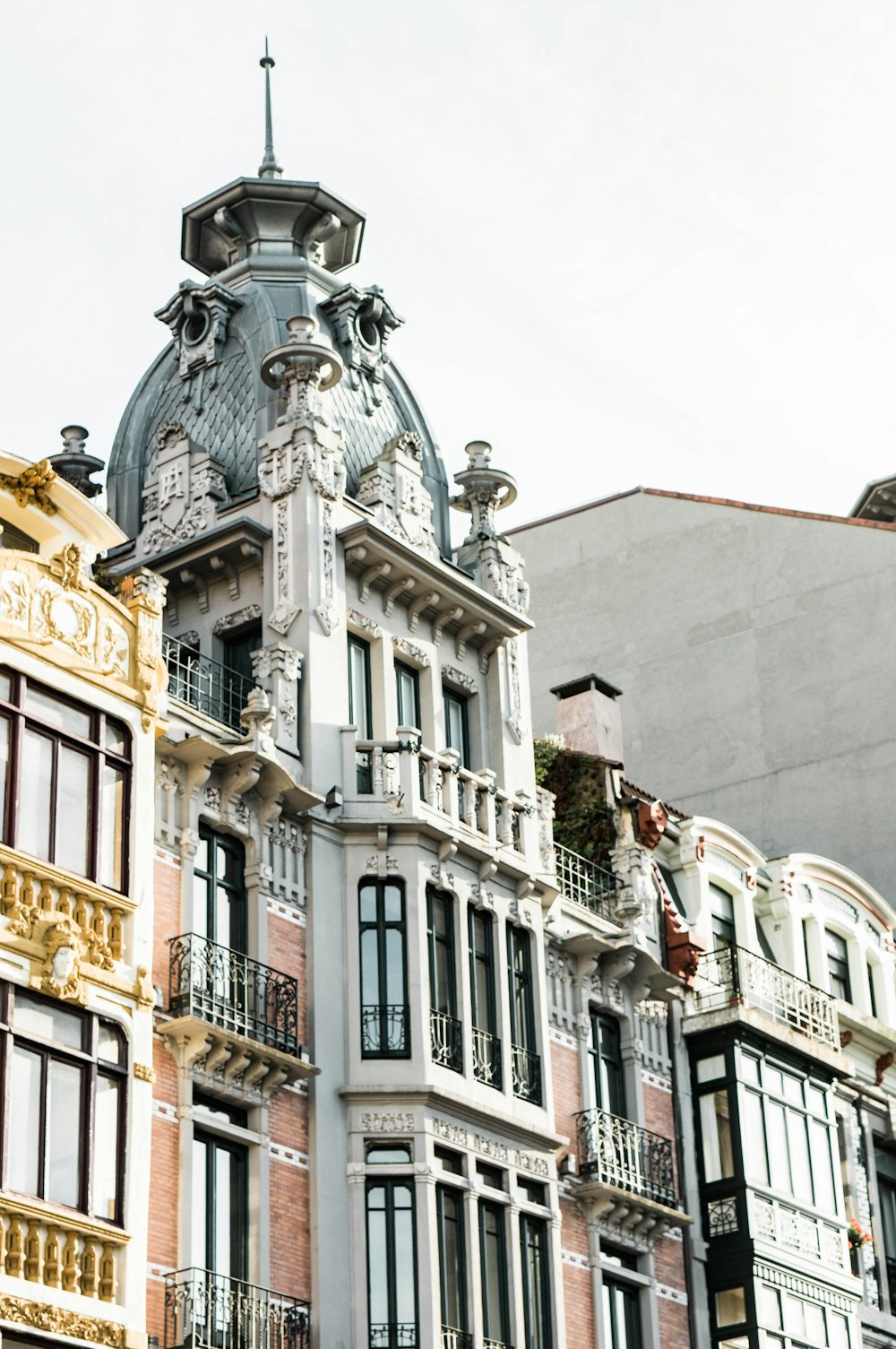 white concrete building with statue