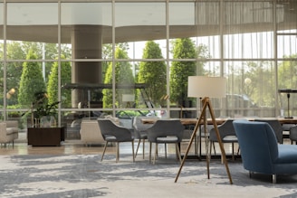 Modern office lobby with natural light and sleek blue accents.
