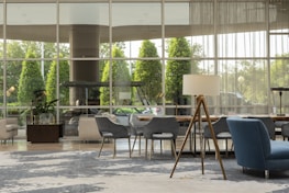 Comfortable hotel lobby with plush seating and soft natural light.