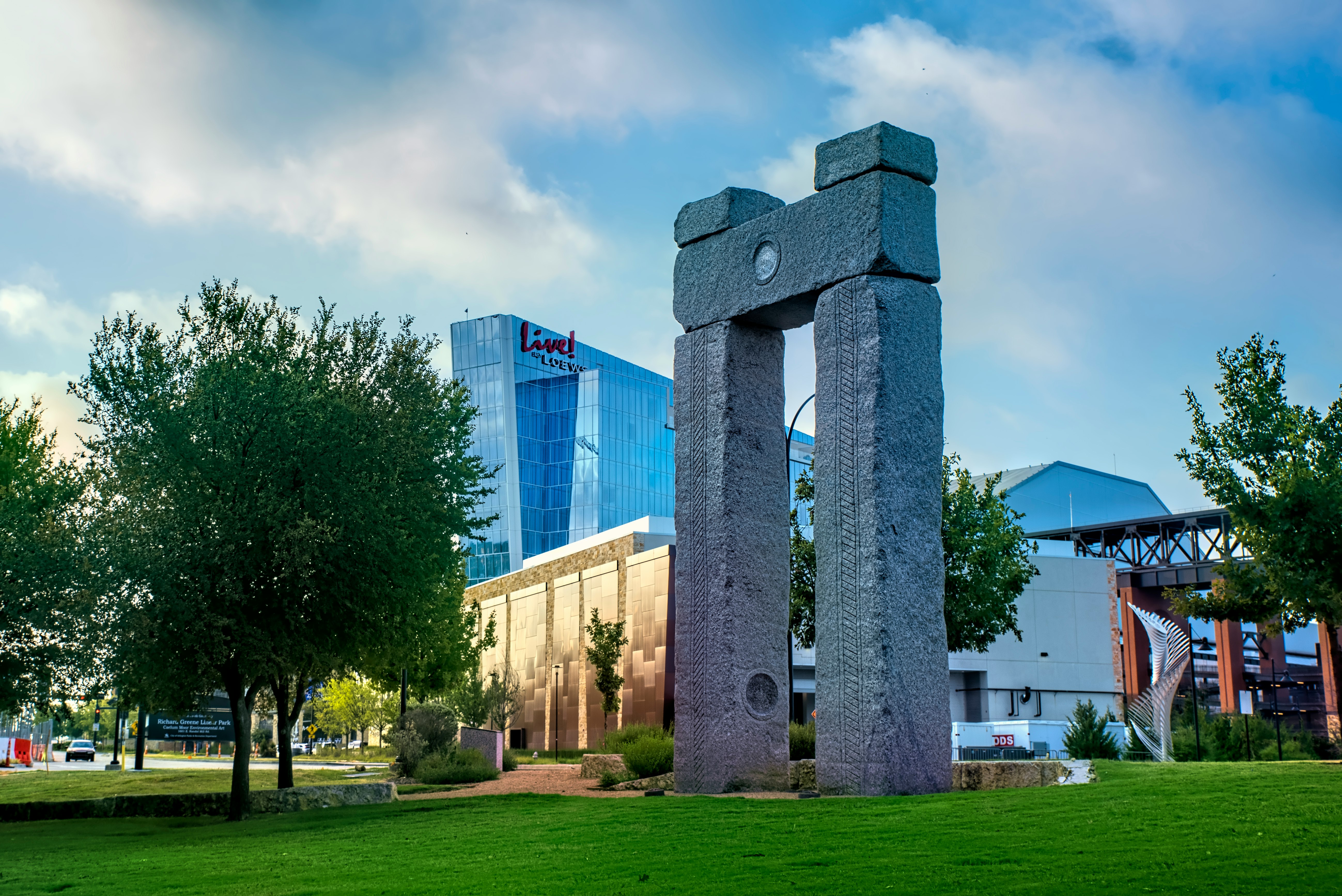 gray concrete building near green grass field during daytime