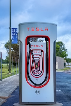 a tesla charging station on the side of the road
