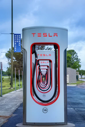 a tesla charging station on the side of the road