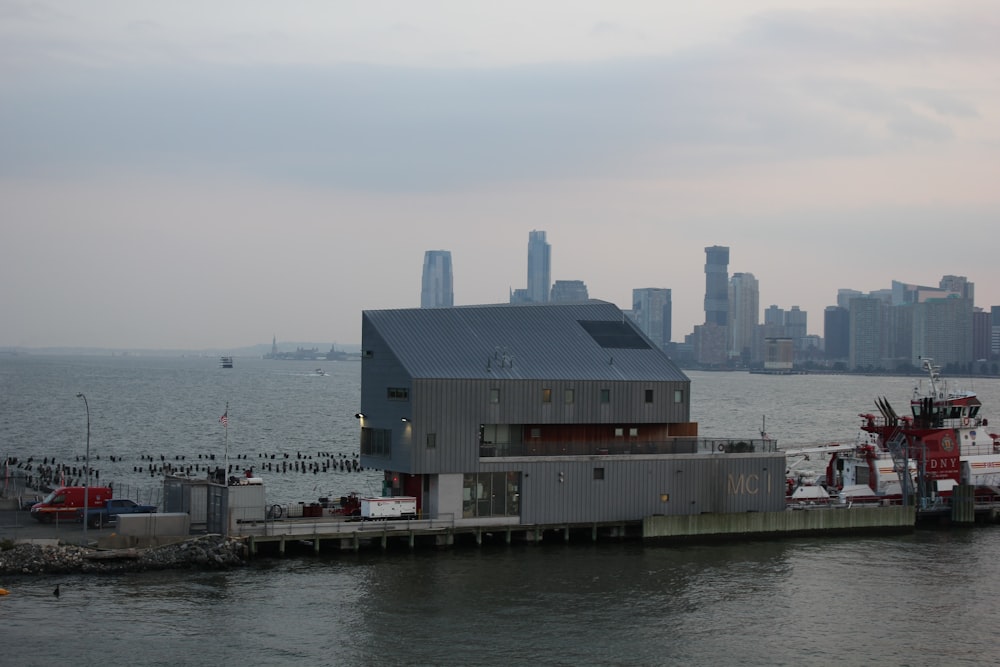 gray concrete building near body of water during daytime