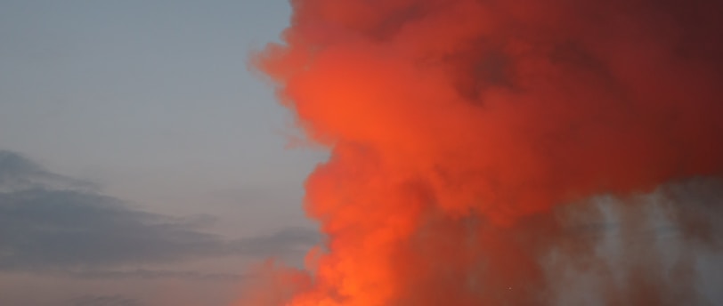 silhouette of mountain under cloudy sky during daytime