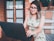 woman in green and white floral tank top wearing black framed eyeglasses