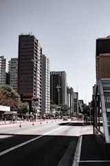 people walking on pedestrian lane near high rise buildings during daytime