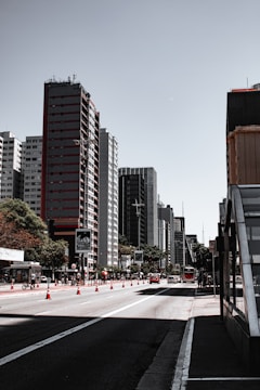 people walking on pedestrian lane near high rise buildings during daytime