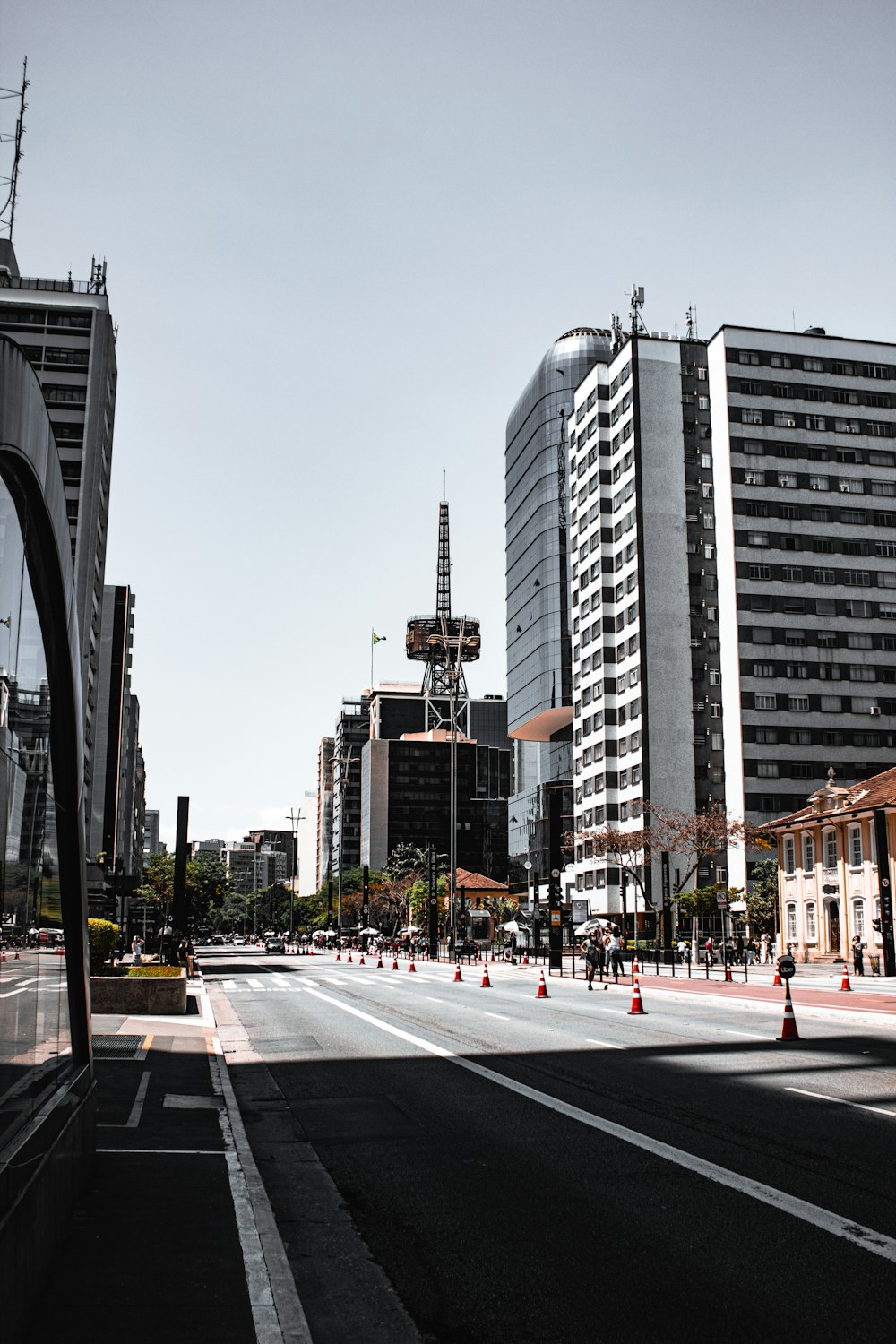 cars on road near city buildings during daytime