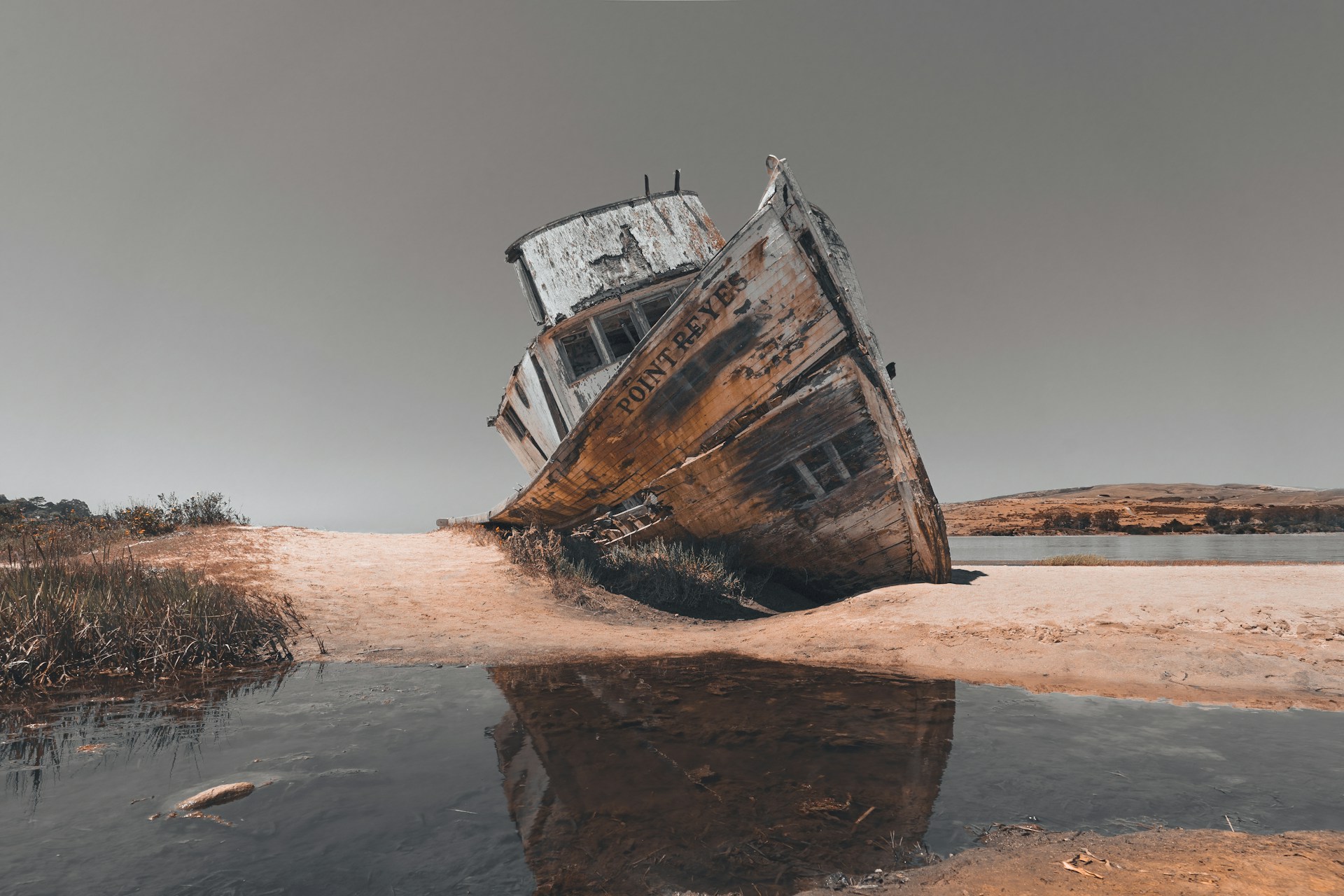 brown and white ship on shore during daytime