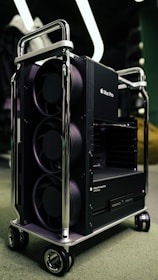 black and gray speaker on gray carpet