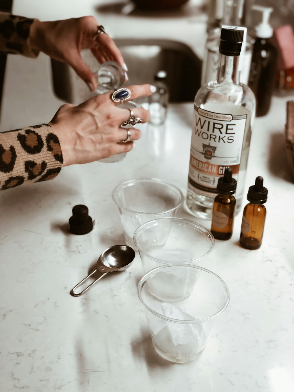 person holding clear drinking glass