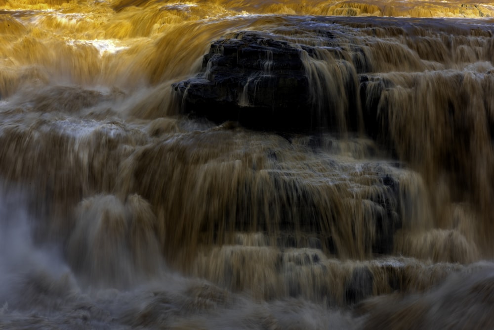 time lapse photography of water falls