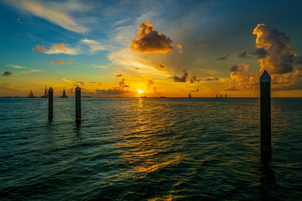 body of water under blue sky during sunset