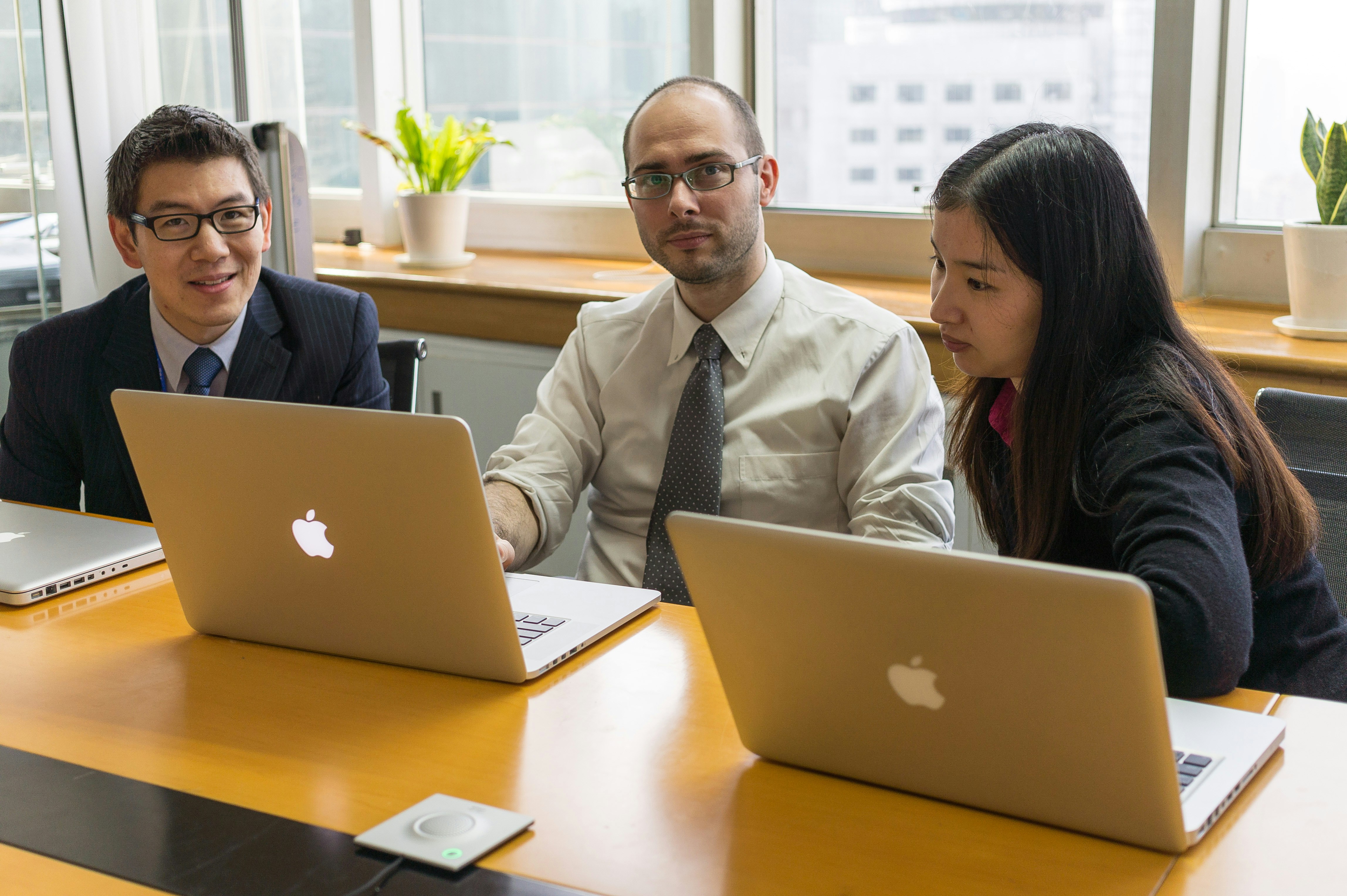 Two professionals collaborating over a financial report, symbolizing independent review and cross-functional collaboration - bookkeeping accounting firm