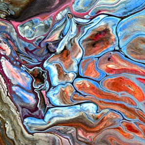An abstract pattern of swirling colors and shapes.
