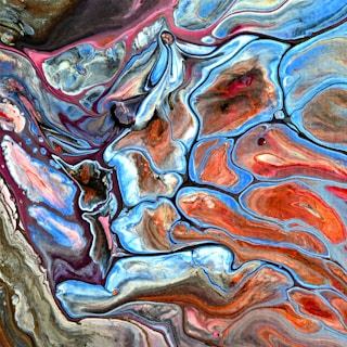 An abstract pattern of swirling colors and shapes.