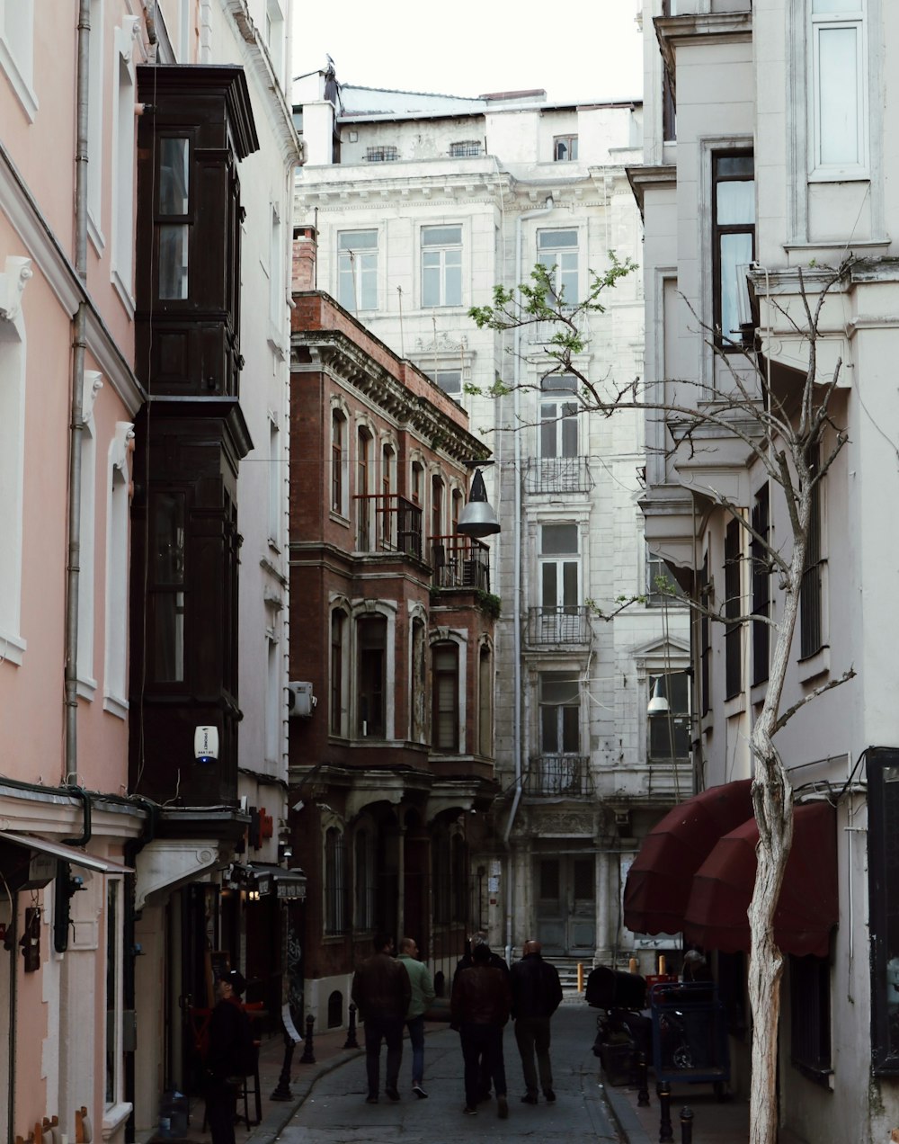 people walking on street near buildings during daytime