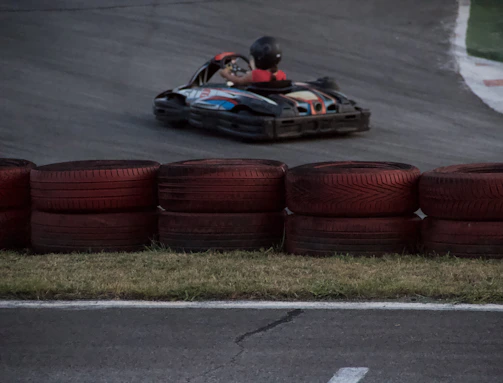 Savannah zooming around a sharp corner, kart tilted slightly as she takes the turn with precision.