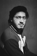 man in black framed eyeglasses