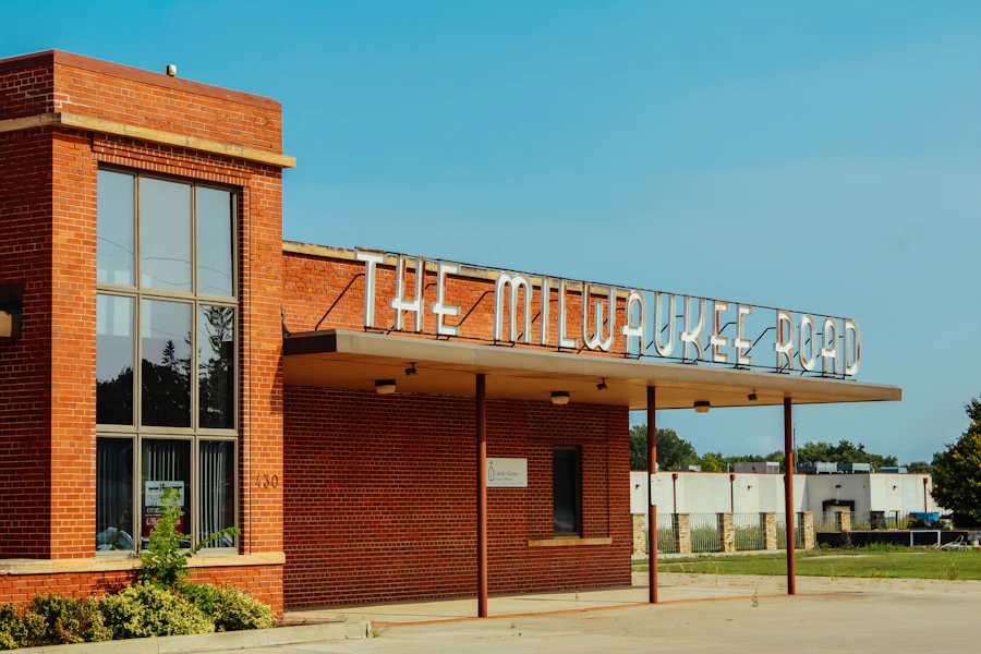 A brick building with a Milwaukee Road sign on its roof